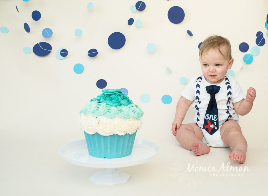 Cake Smash Session Looking At Cake Photo