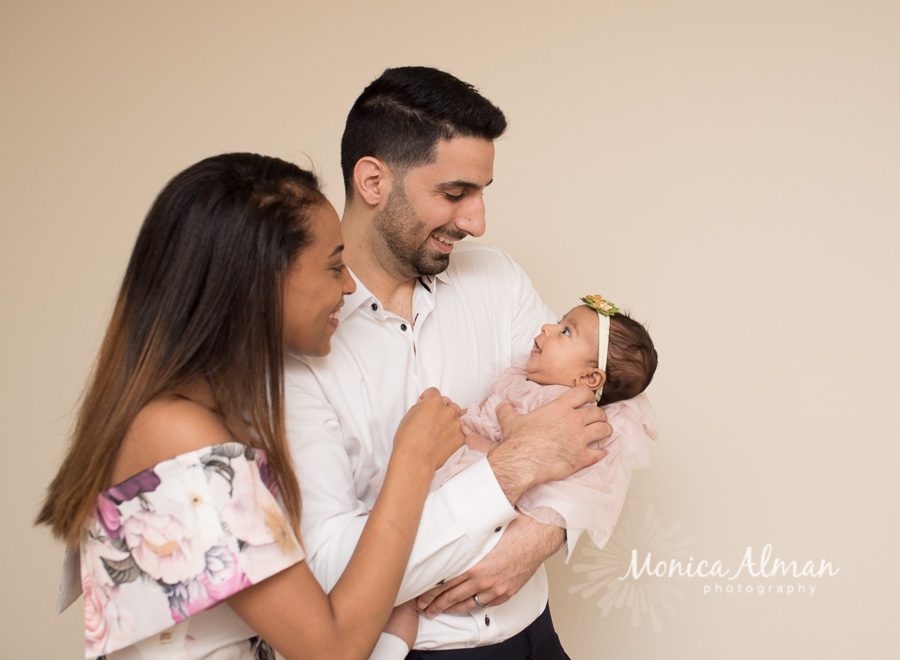 Two Month Old Baby Girl Smiling At Parents Photo