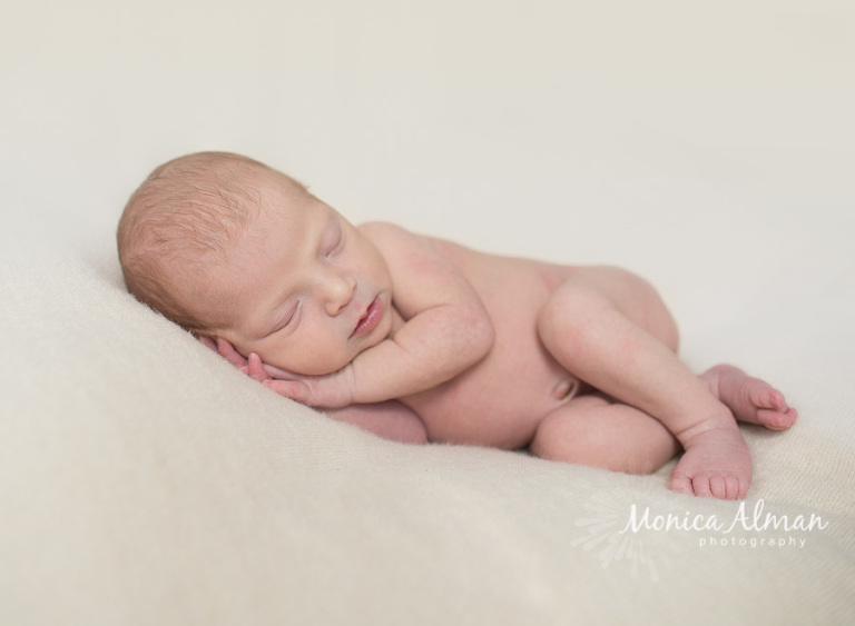 Beautiful Newborn Baby Girl Baby Lying on Side Photo