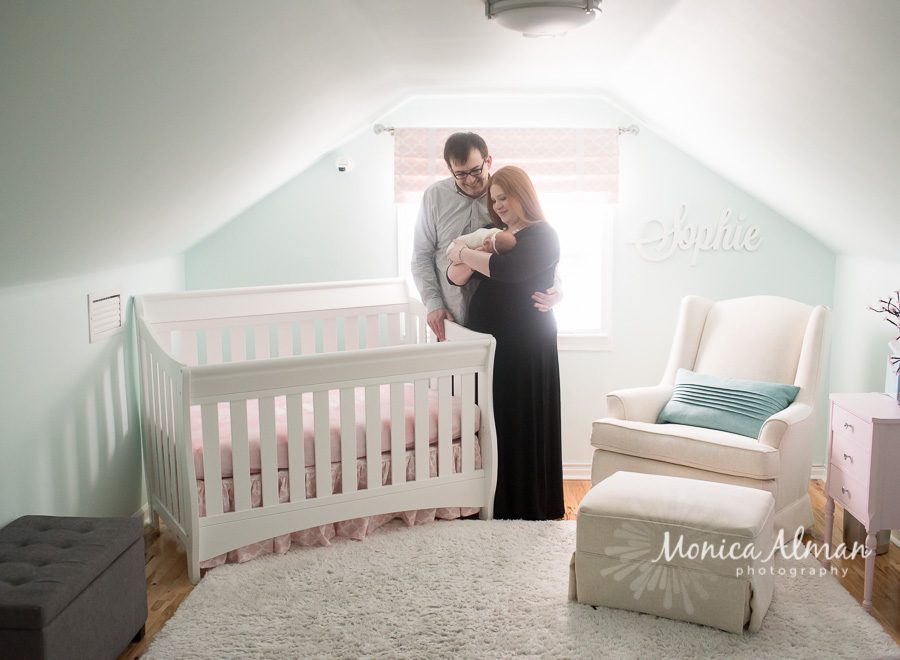 Beautiful Newborn Baby Girl Mom and Dad by Crib Photo