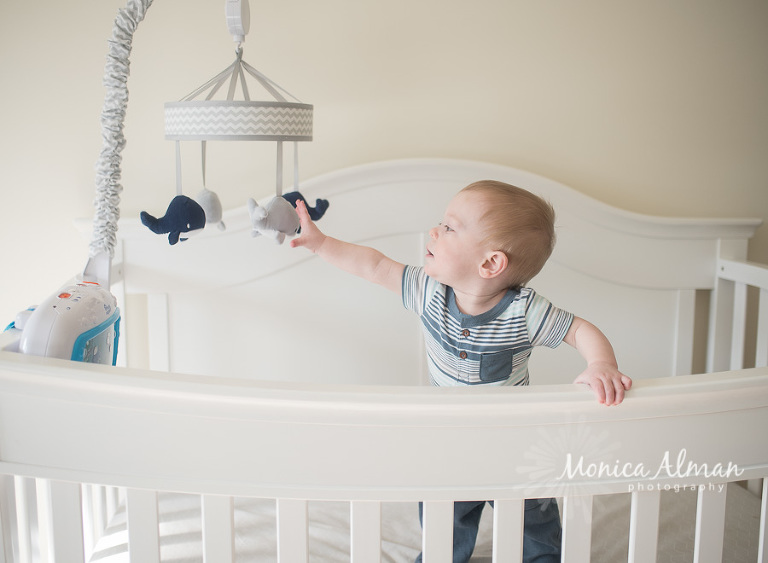 Baby Boy Milestone Session Playing in Crib Photo