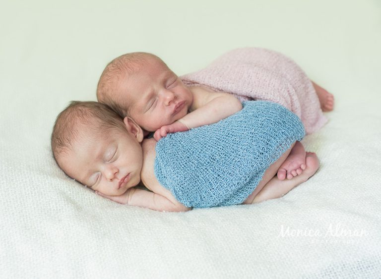 Baby Boy and Girl Twins Laing on Each other Photo