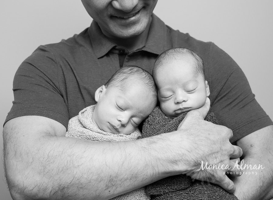 Twin Baby Boys In Dads Arms Photo
