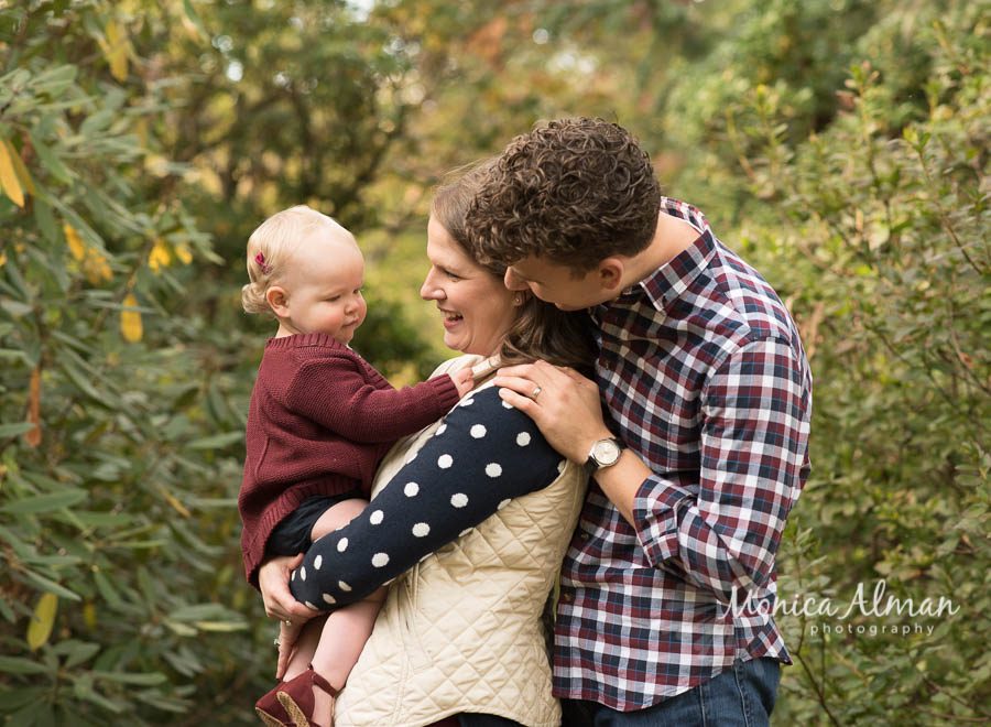 First-Birthday-Portrait-Session-Looking-At-Mom-And-Dad-Photo