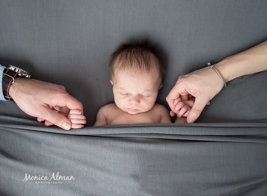 Ten-day-old-baby-boy-holding-hands-photo