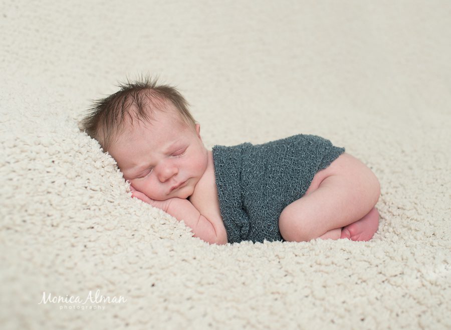 Ten-day-old-baby-boy-on-belly-photo