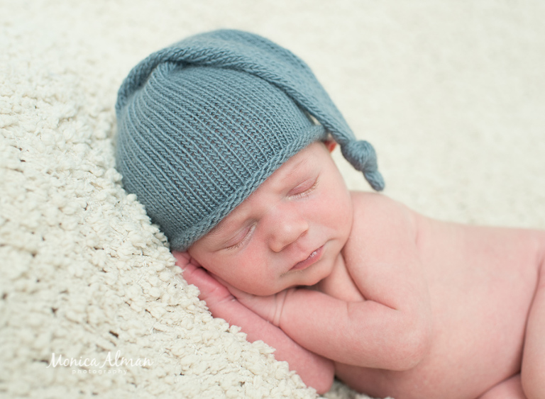 Ten-day-old-baby-boy-in-sleepy-hat-photo