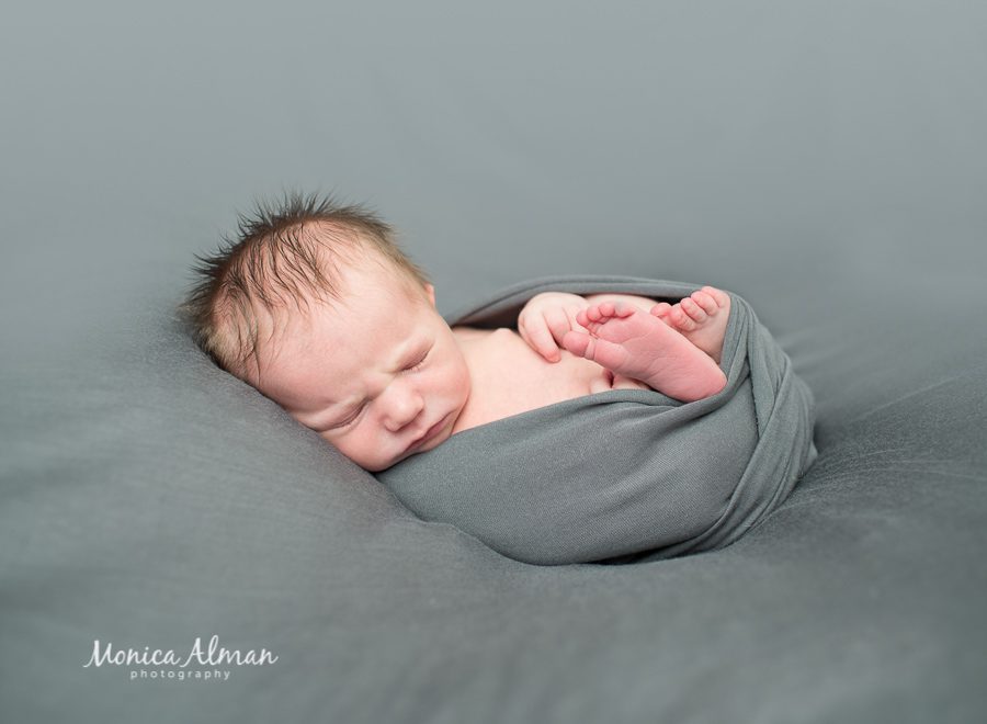 Ten-day-old-baby-boy-curled-up-photo