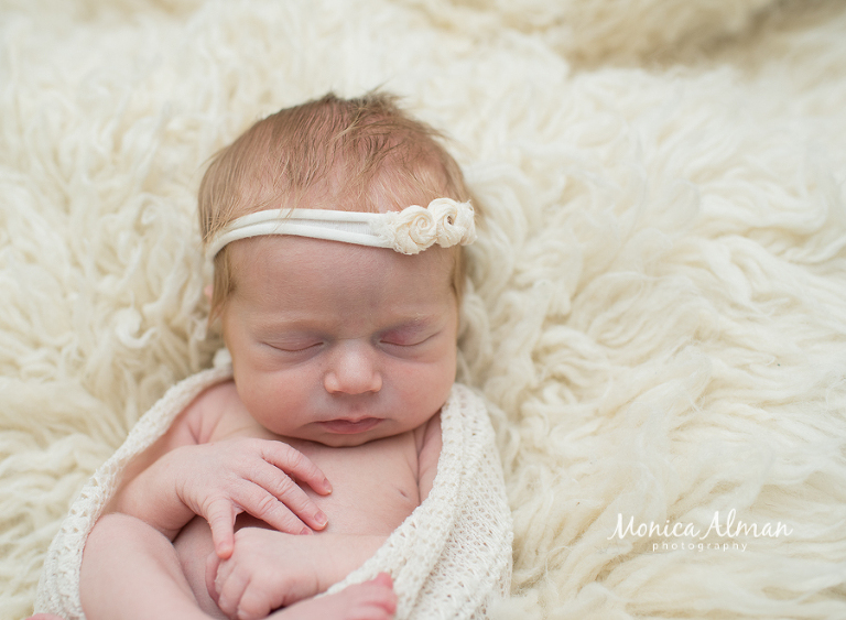 Maryland newborn photographer wrapped on a rug photo