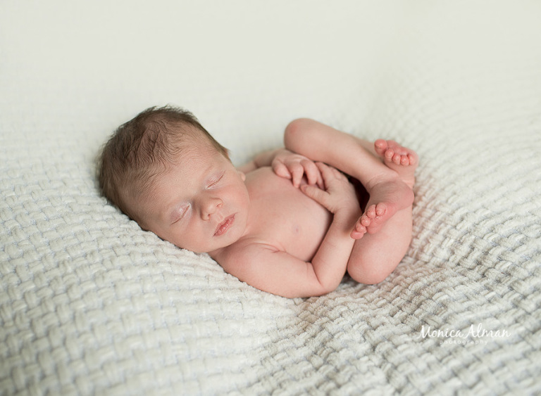 neutral portrait newborn session posed baby boy on blanket photo 