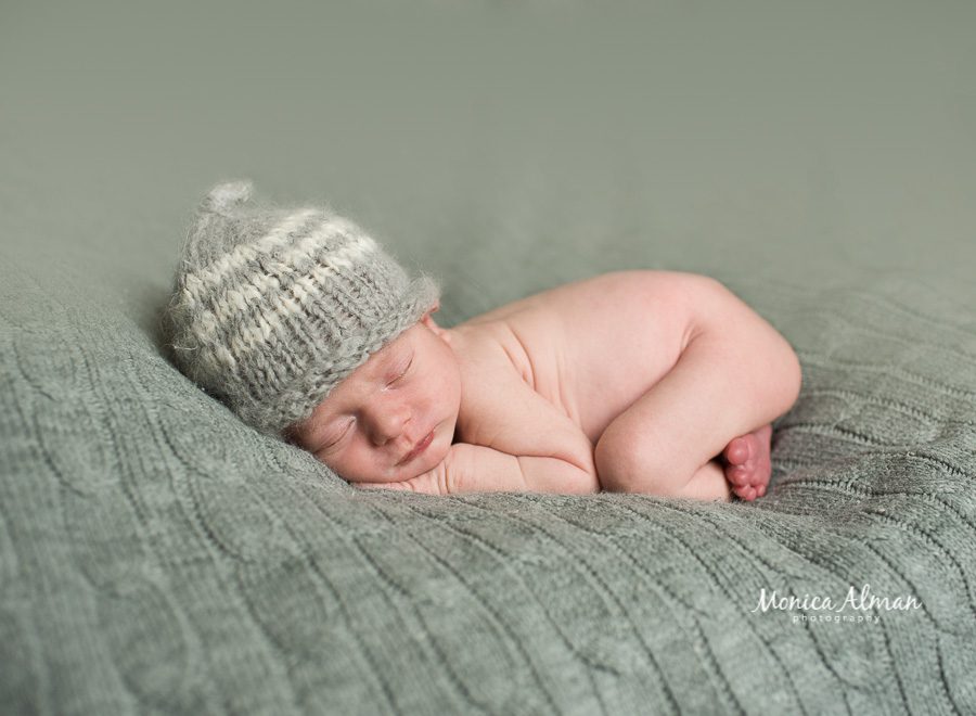 neutral portrait session baby curled up photo