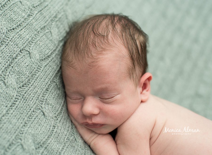 neutral portrait newborn session baby on gray blanket phot