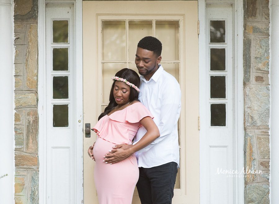 fall maternity session soon to be parents in front of house photo