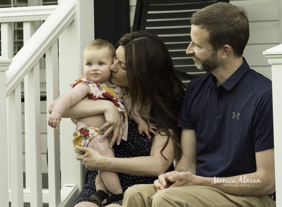 Rockville Family Photographer mom and dad kissing baby