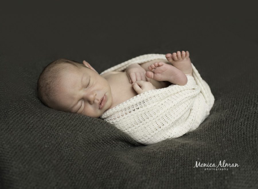 baby boy curled up photo