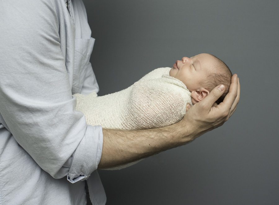 dad holding baby boy photo