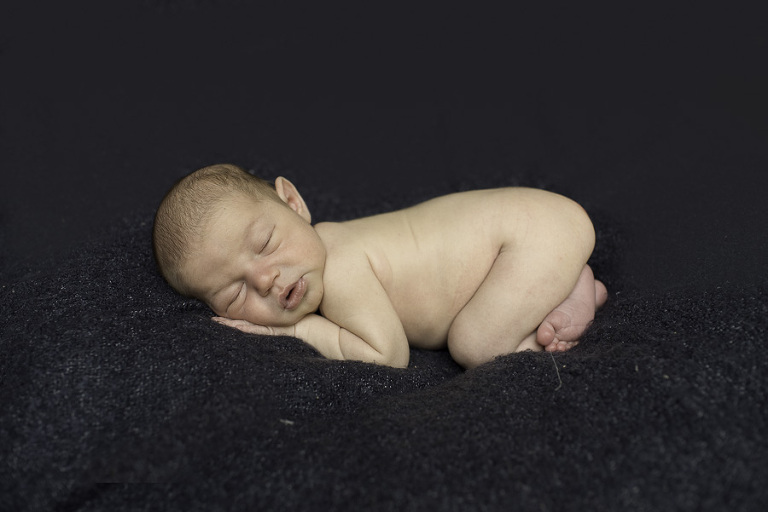 newborn on blanket photo