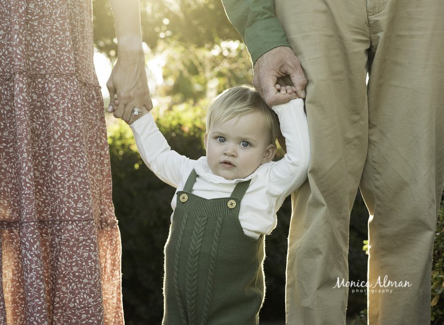 1st birthday standing with mom and dad picture