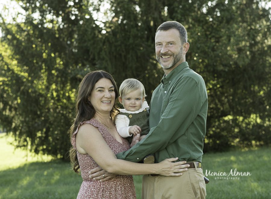 parents with 1 year old baby photo