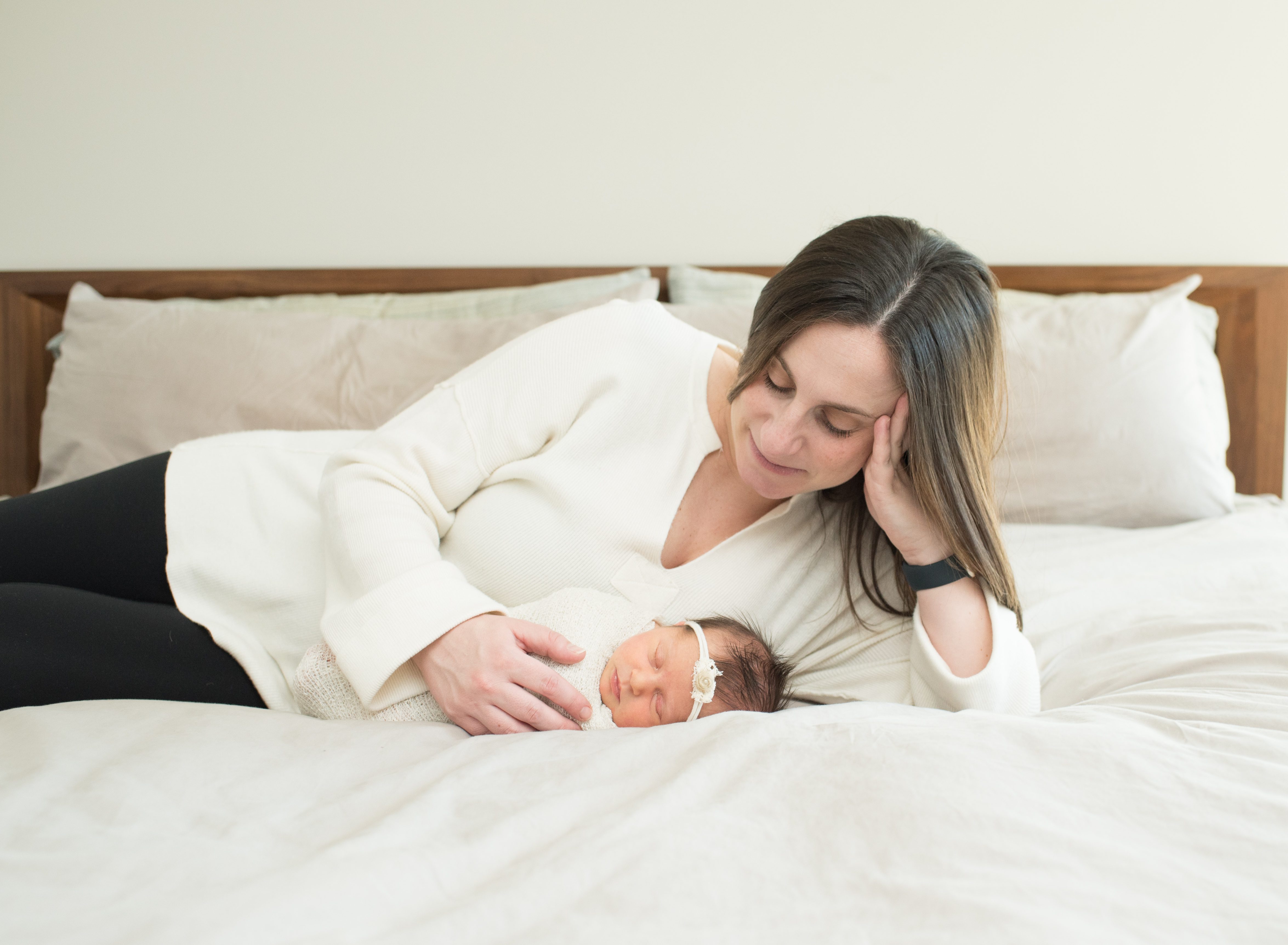 image of mom looking at newborn baby 