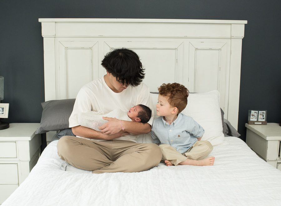 siblings with new baby sister photo
