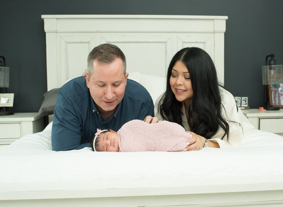 new parents photo with baby girl