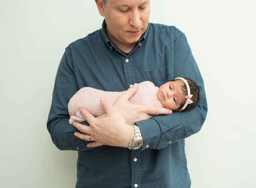 dad holding new baby girl picture