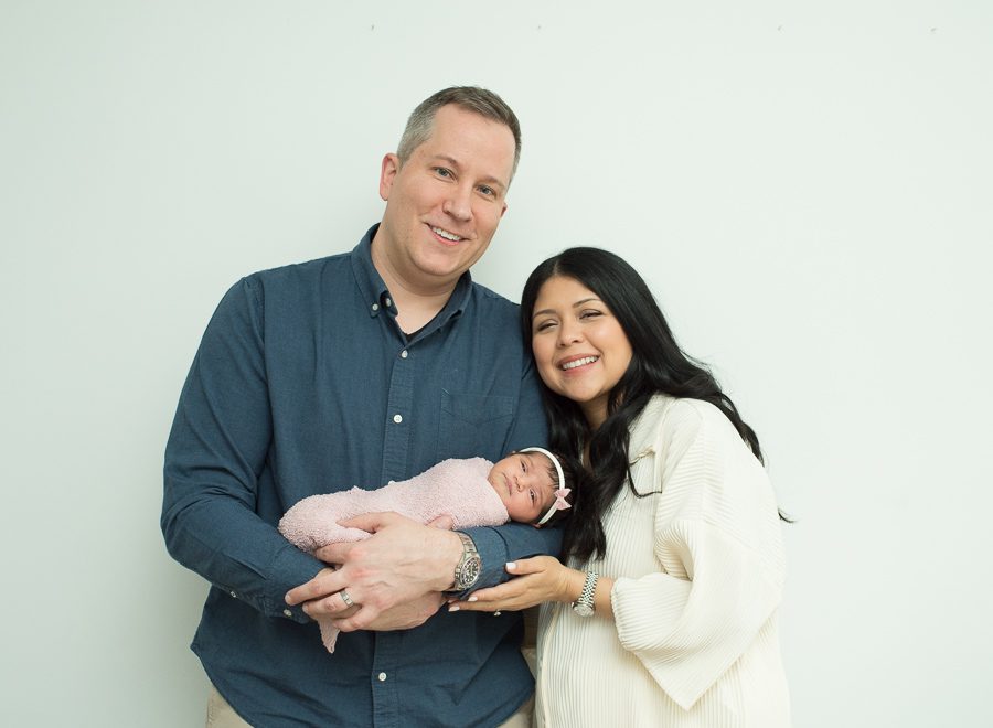 mom and dad with baby girl picture