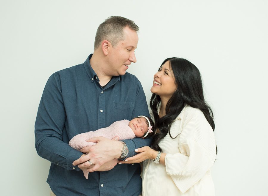 mom and dad photo with new baby