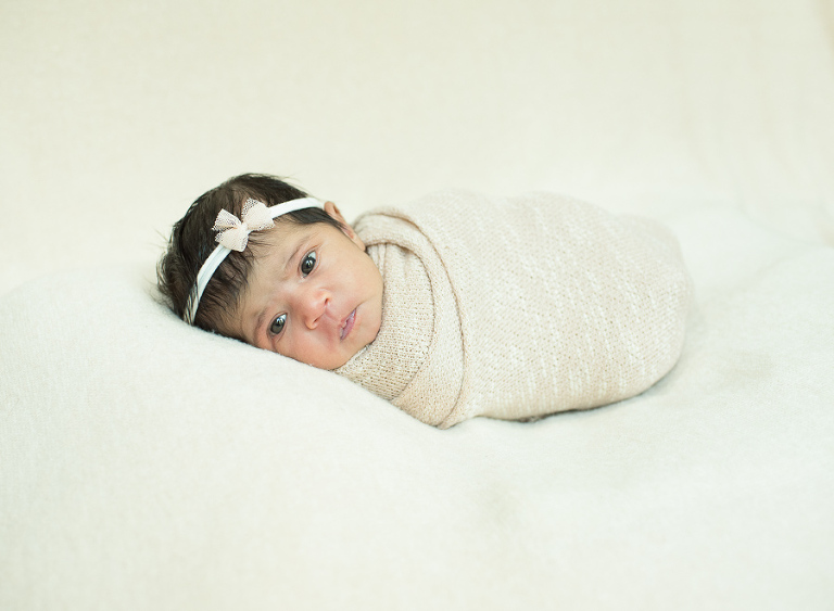 Baby wrapped up for newborn photos
