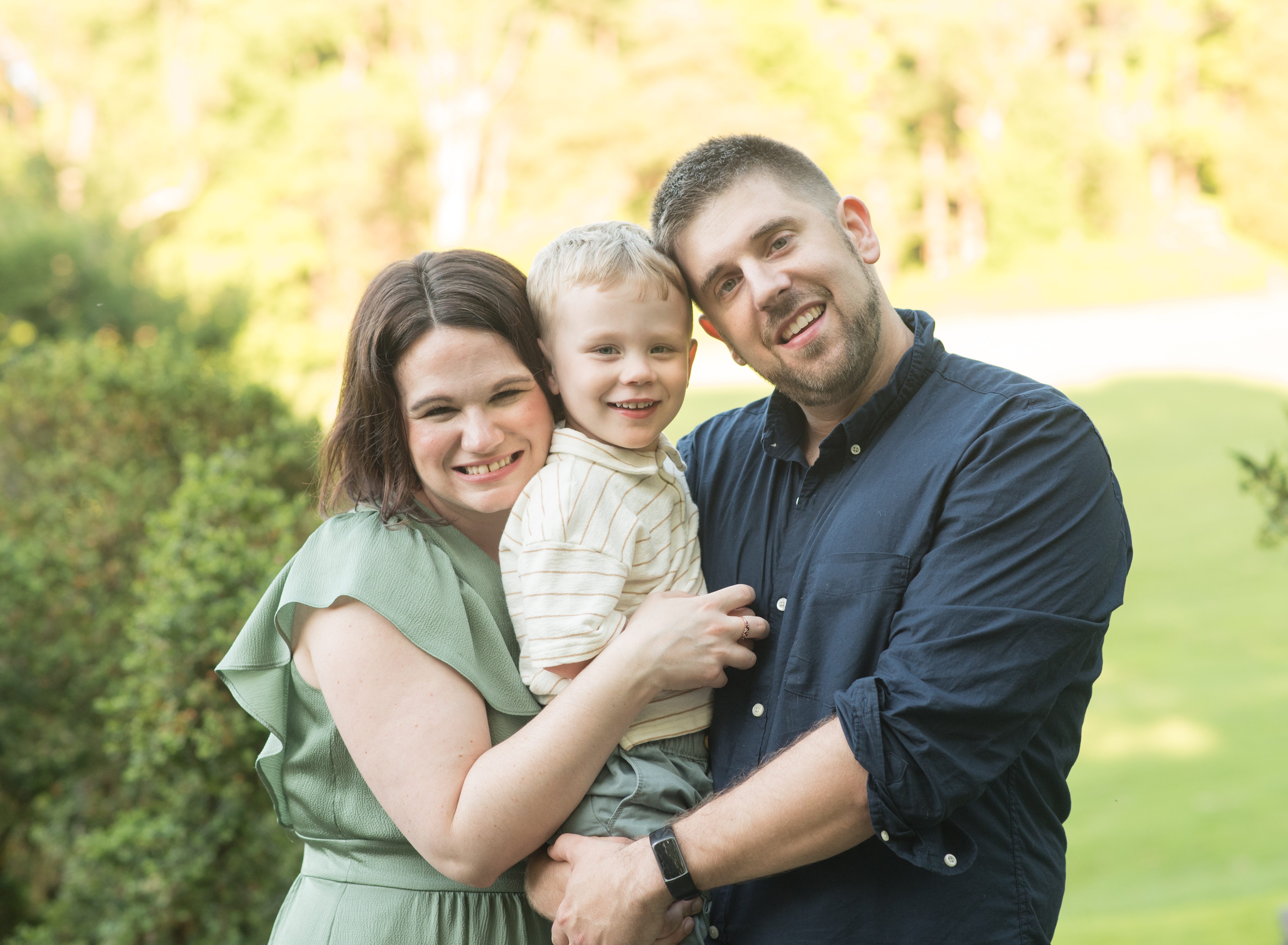 mom and dad with little boy photo