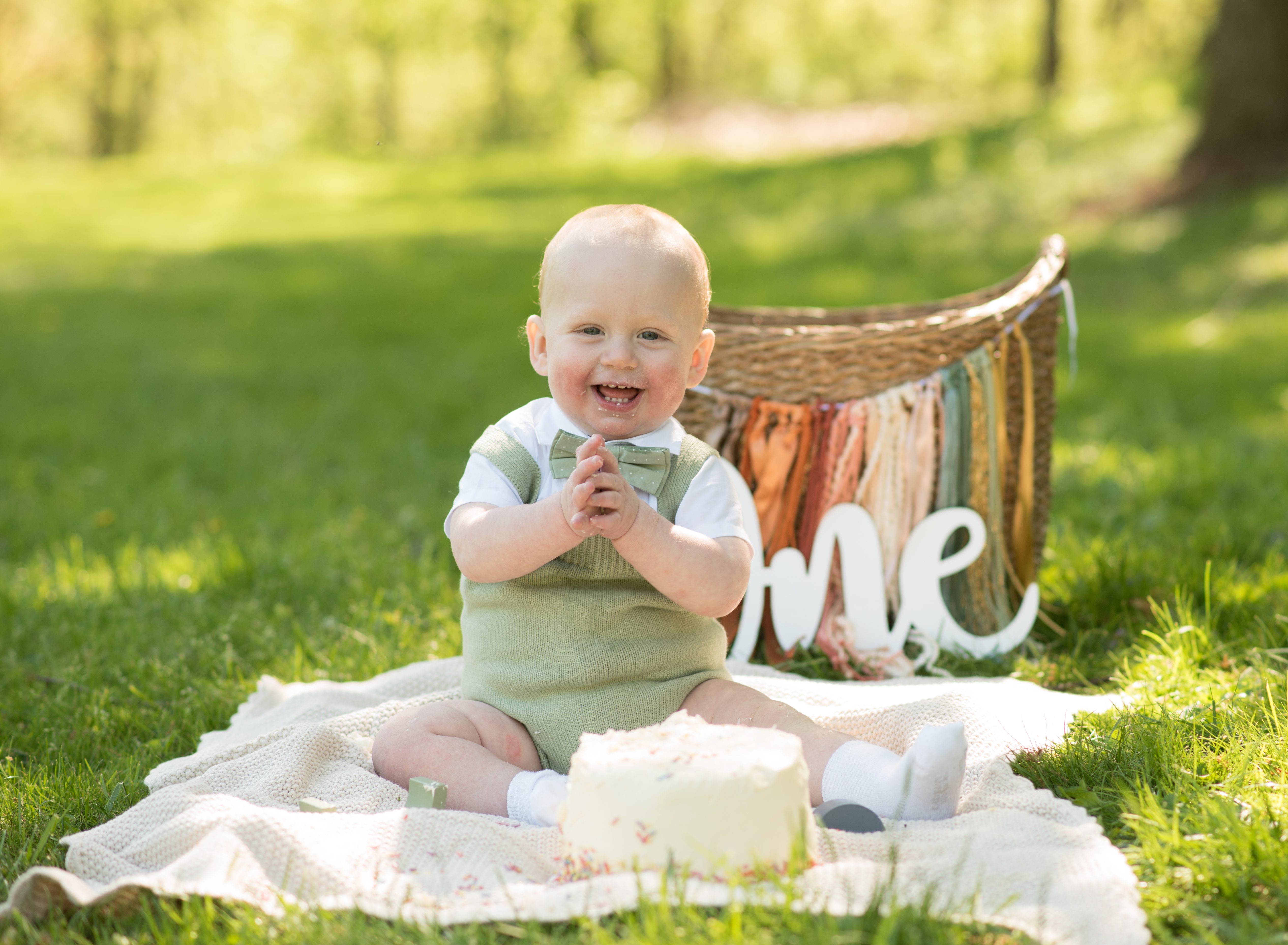 Baby celebrating first birthday with a cake smash in Maryland