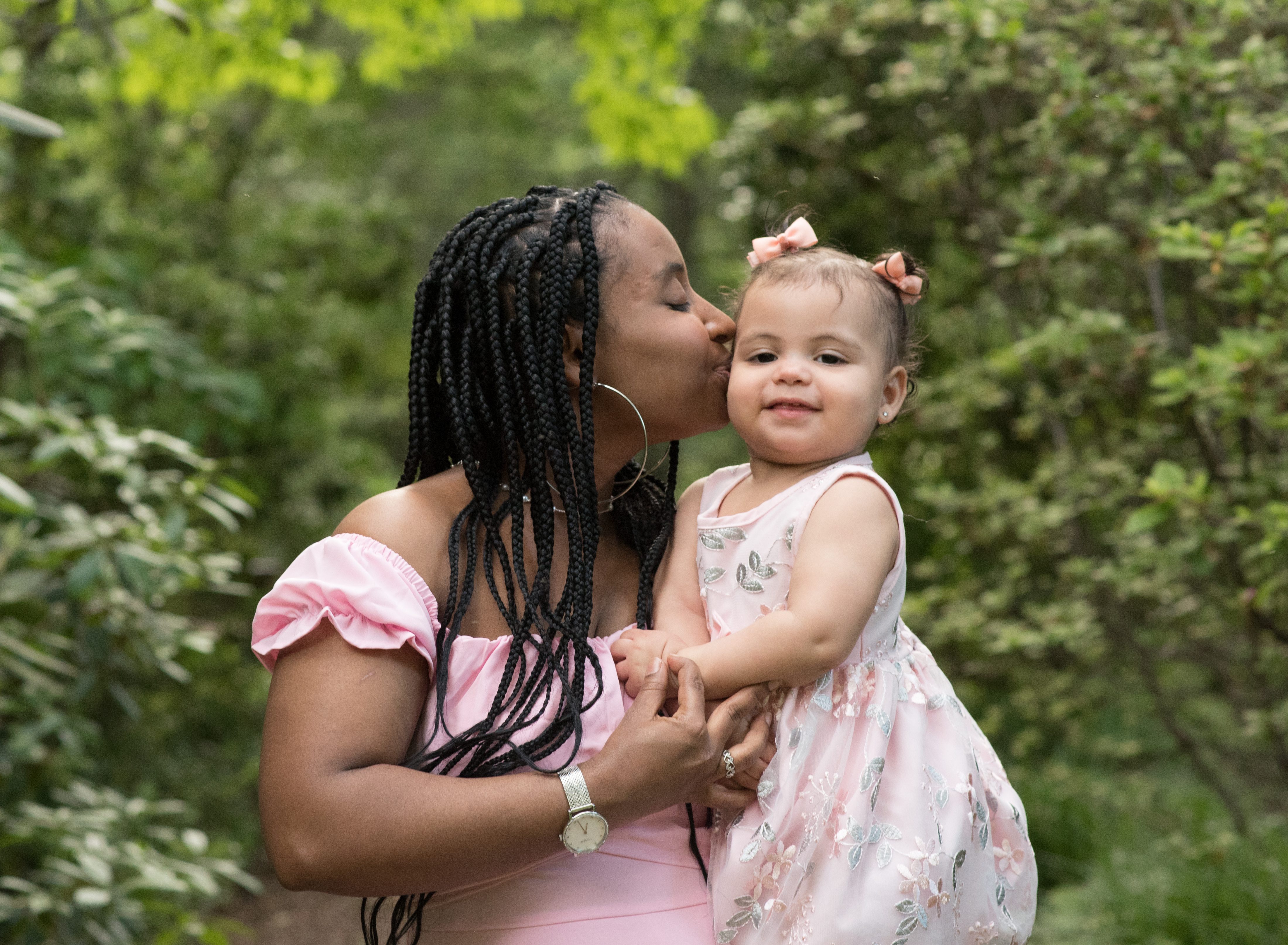 mom kissing baby photo