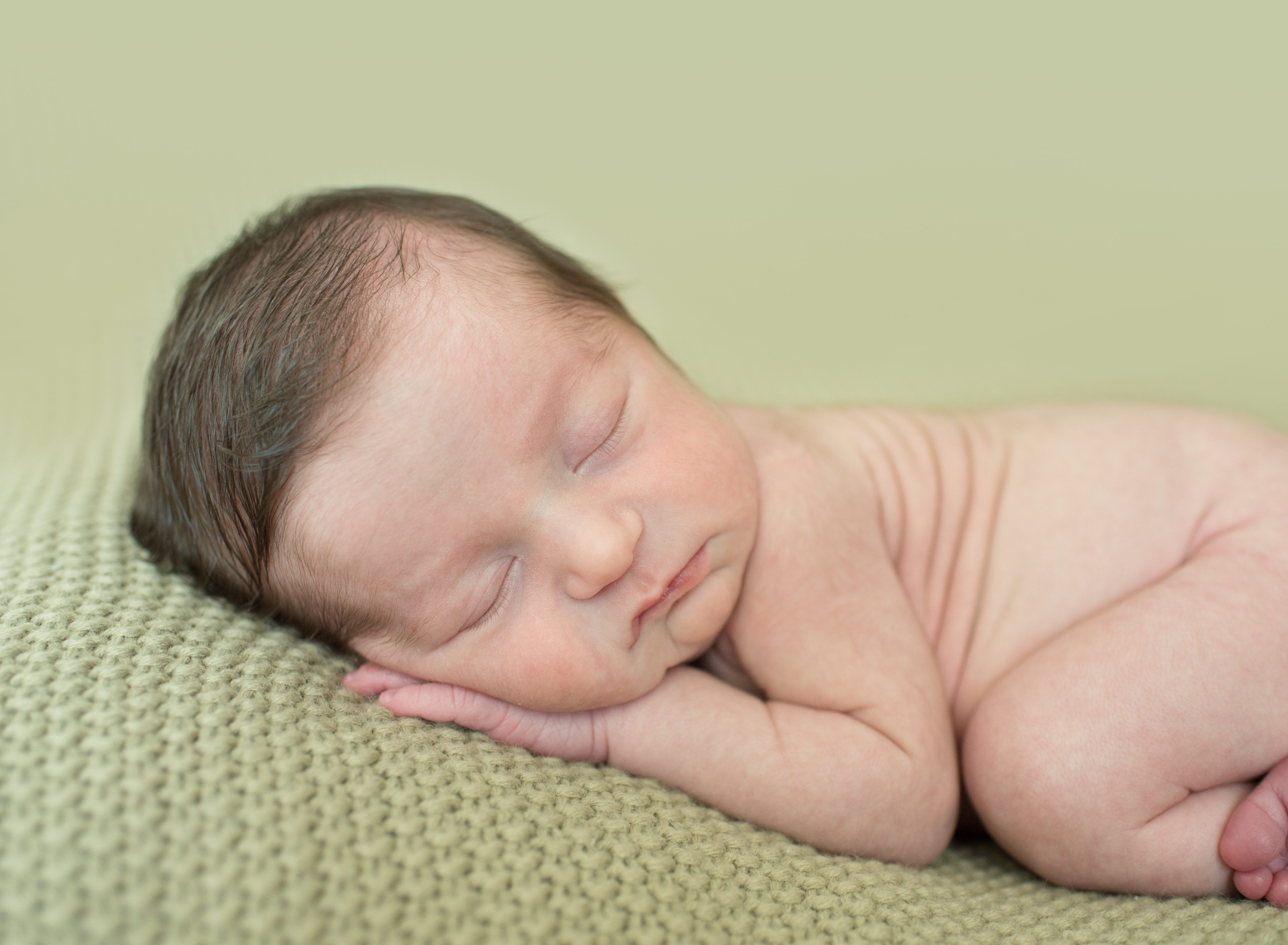 close up of baby on blanket photo