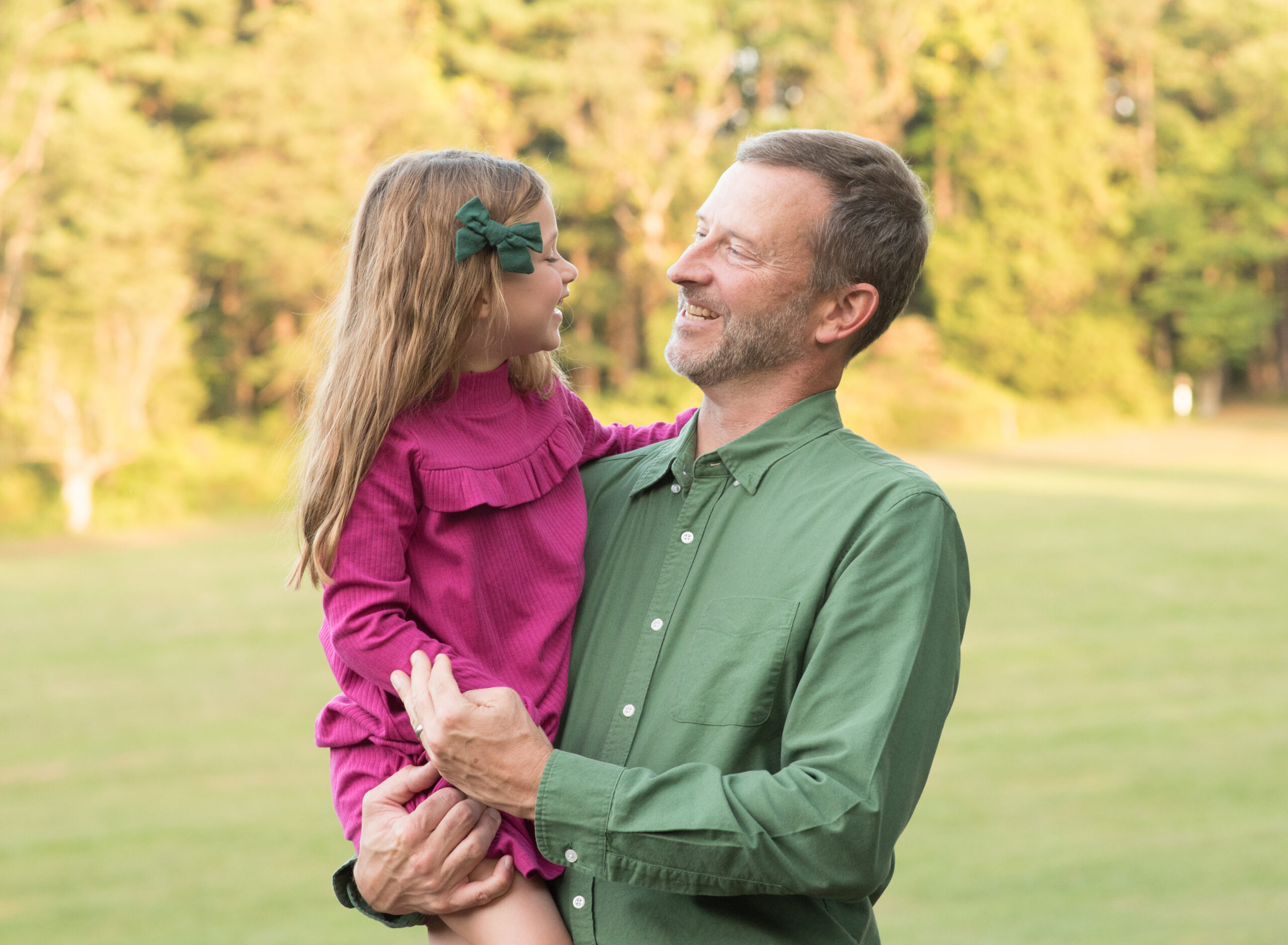 dad and daughter looking at each other photos in maryland