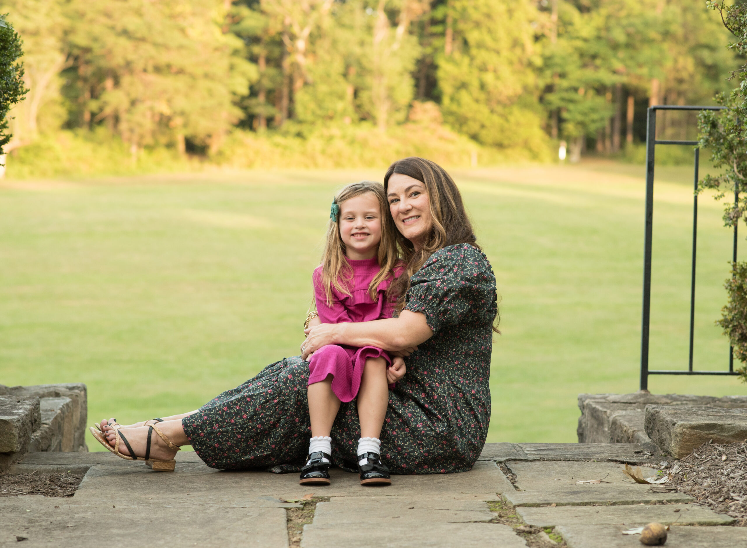 mom and daughter sitting during photo session in Maryland