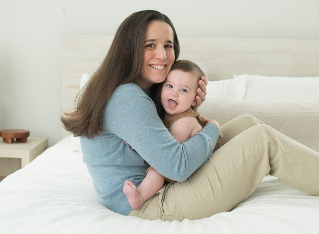 mom hugging 6 month old photo