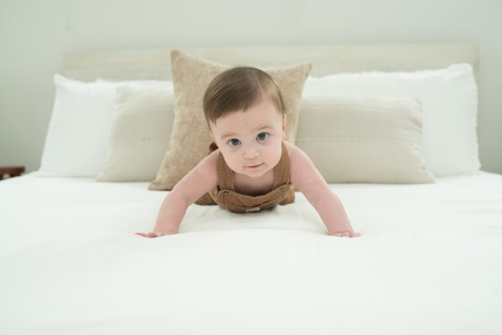 baby pushing himself up photo