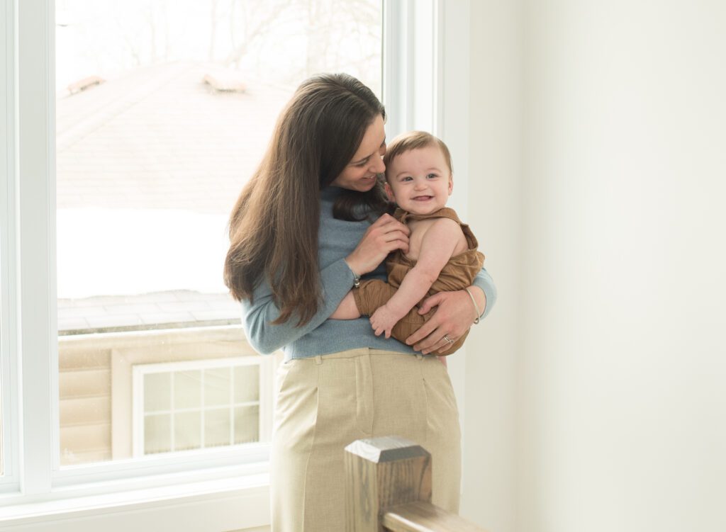 mom snuggling her baby boy photo