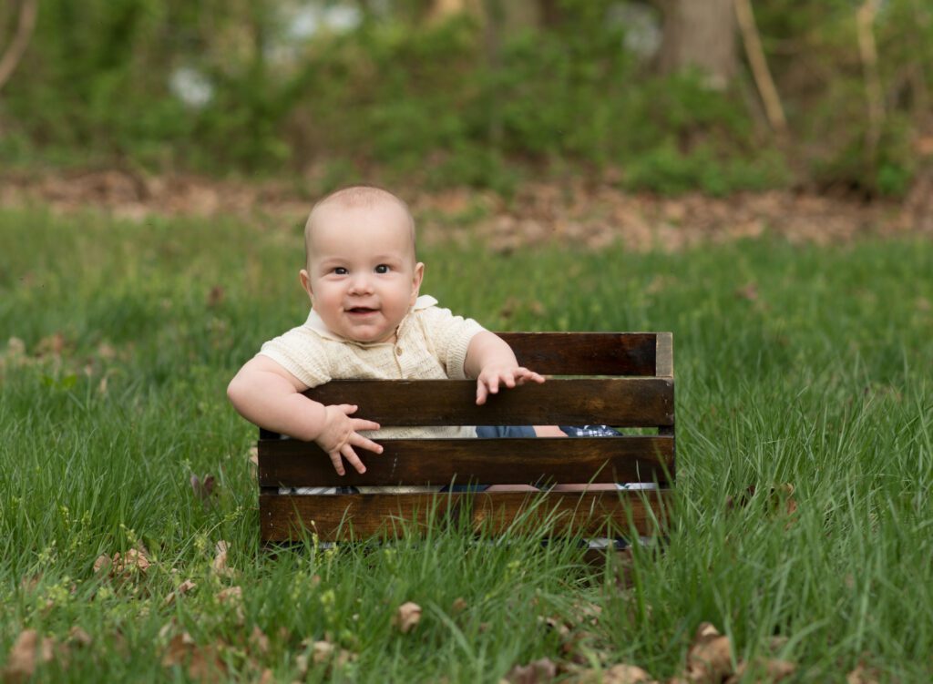 baby sitting in a prop photo
