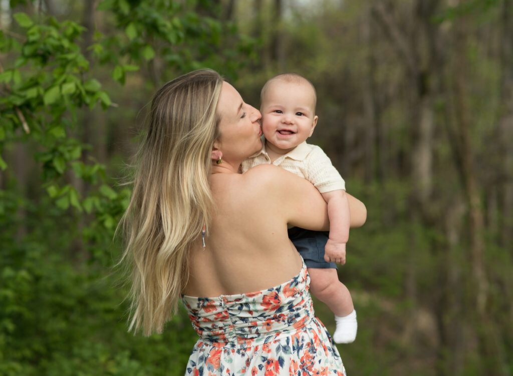 mother kissing her baby boy photo