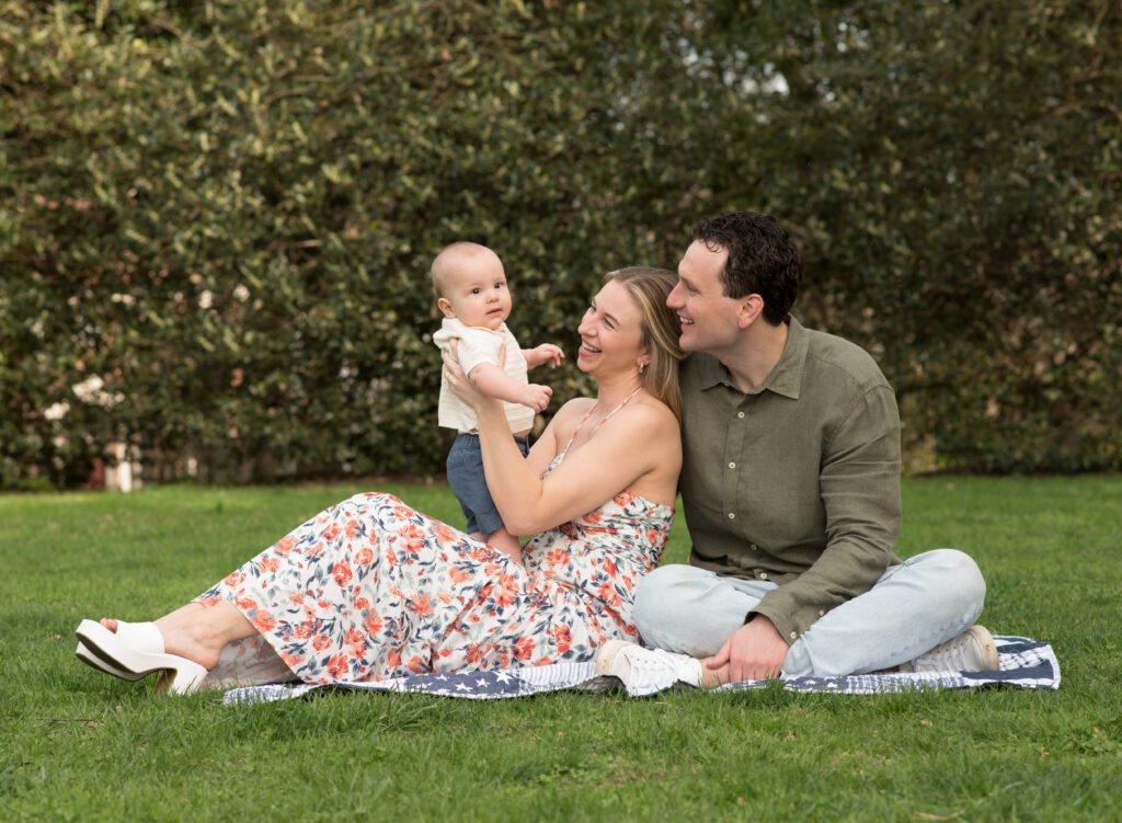 mom and dad playing with baby boy photo