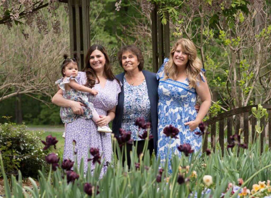 grandma with family in the gardens photo
