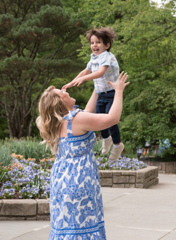 little boy having fun with family photo